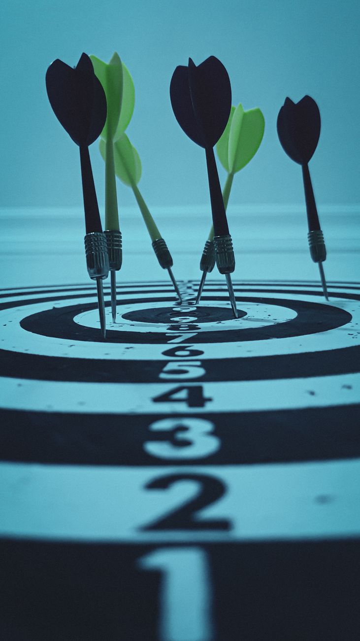 precision darts hitting the target bullseye